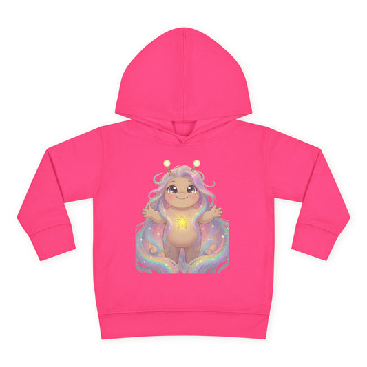Hot pink hoodie featuring a cute pastel creature with antennae, long flowing multi-colored hair, arms raised joyfully, a glowing yellow star on its chest, sitting on rainbow waves.