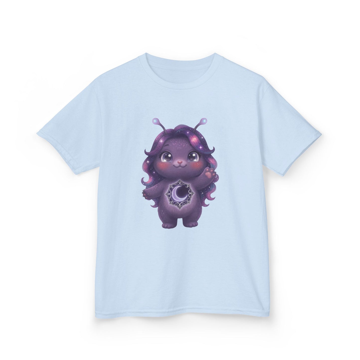 Light blue crew-neck t-shirt featuring a cute purple galaxy creature with antennae, long wavy hair, and a glowing crescent moon emblem on its chest.