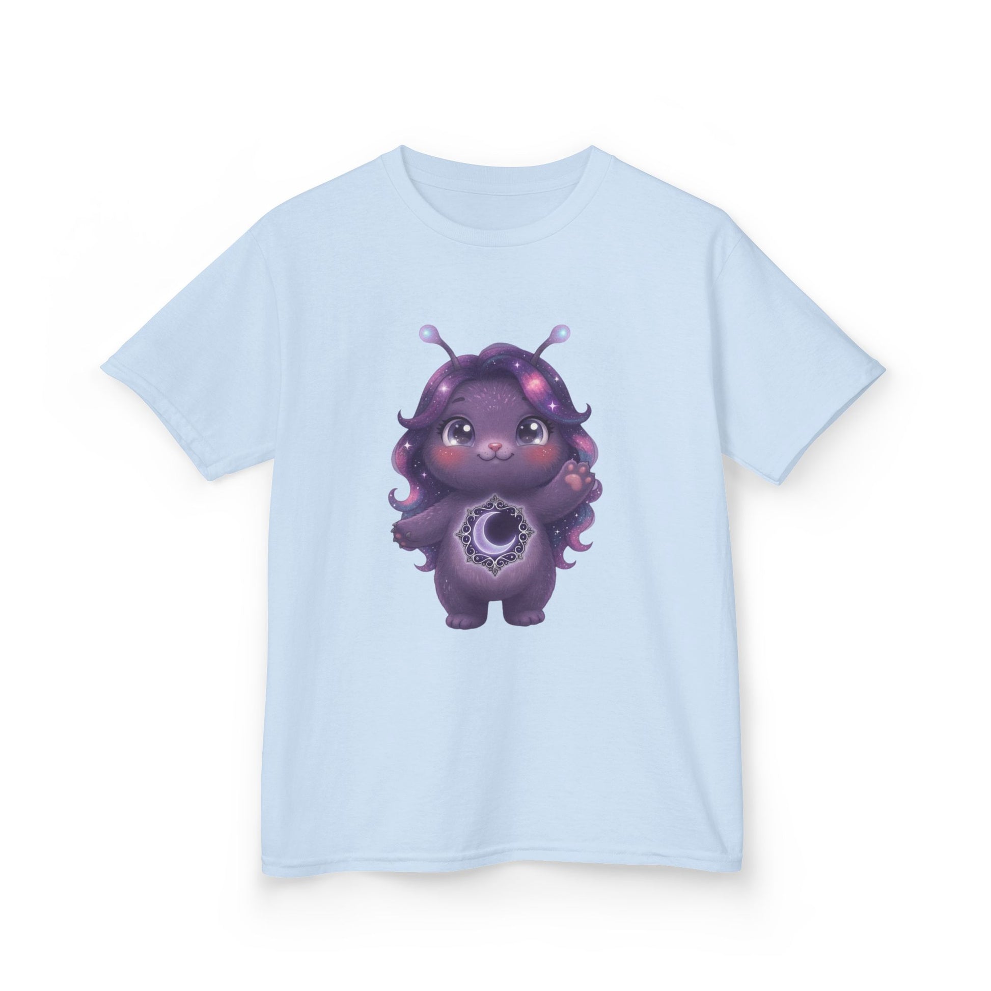 Light blue crew-neck t-shirt featuring a cute purple galaxy creature with antennae, long wavy hair, and a glowing crescent moon emblem on its chest.