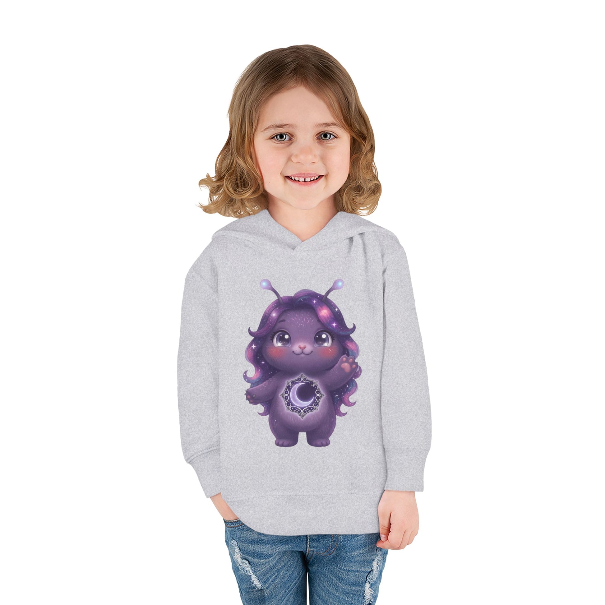 Light gray hoodie featuring a cute purple galaxy creature with antennae, long wavy hair, and a glowing crescent moon emblem on its chest.