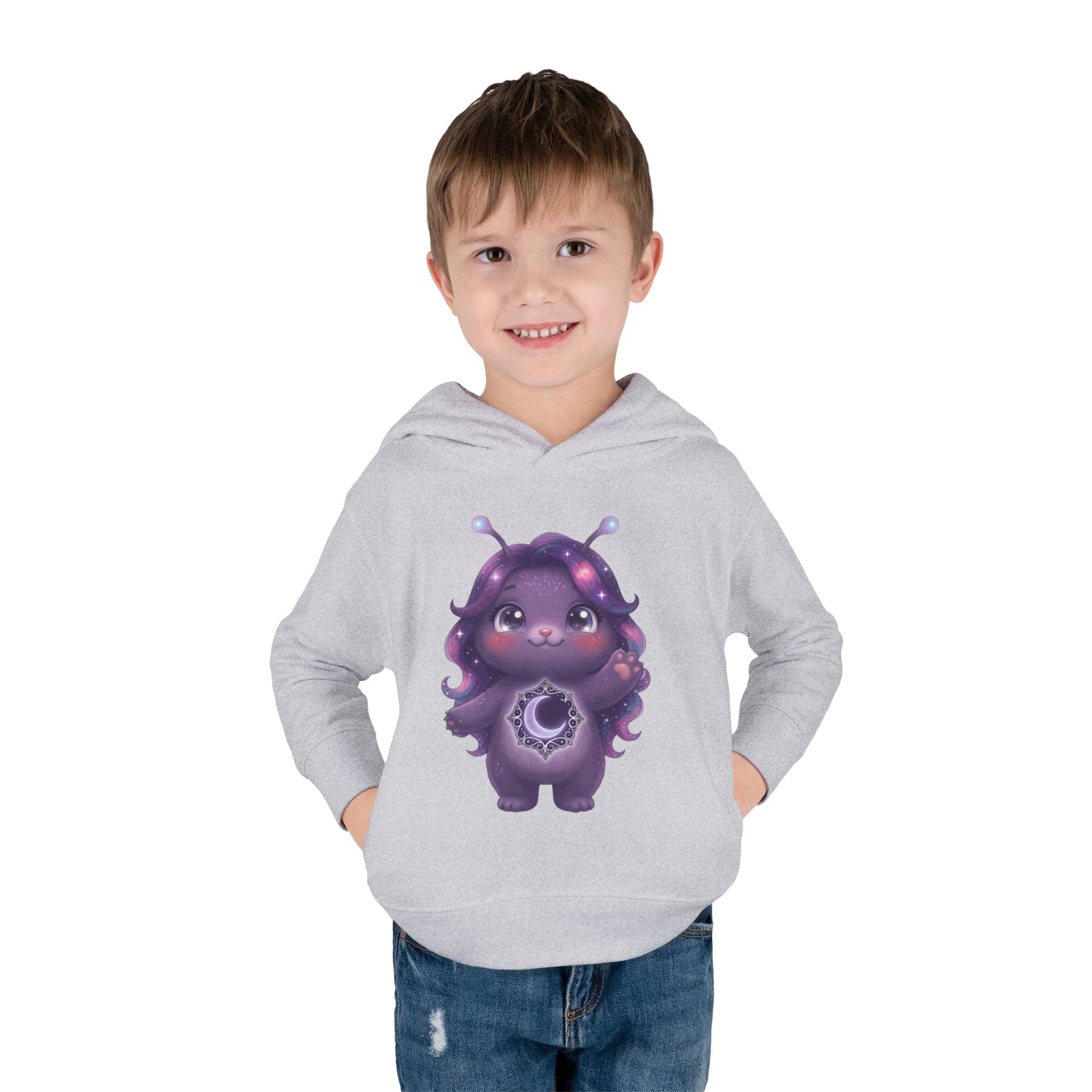 Light gray hoodie featuring a cute purple galaxy creature with antennae, long wavy hair, and a glowing crescent moon emblem on its chest.