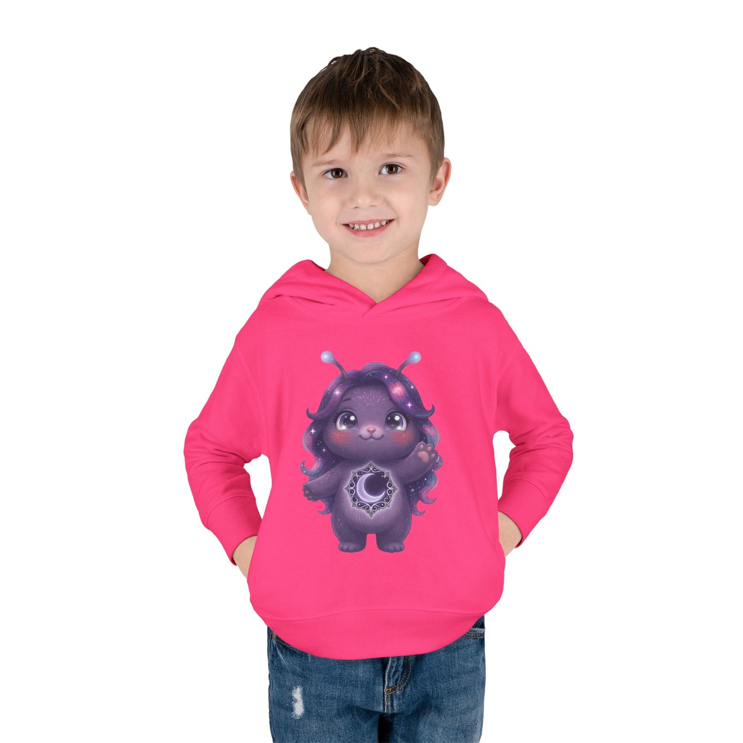 Pink hoodie featuring a cute purple galaxy creature with antennae, long wavy hair, and a glowing crescent moon emblem on its chest.