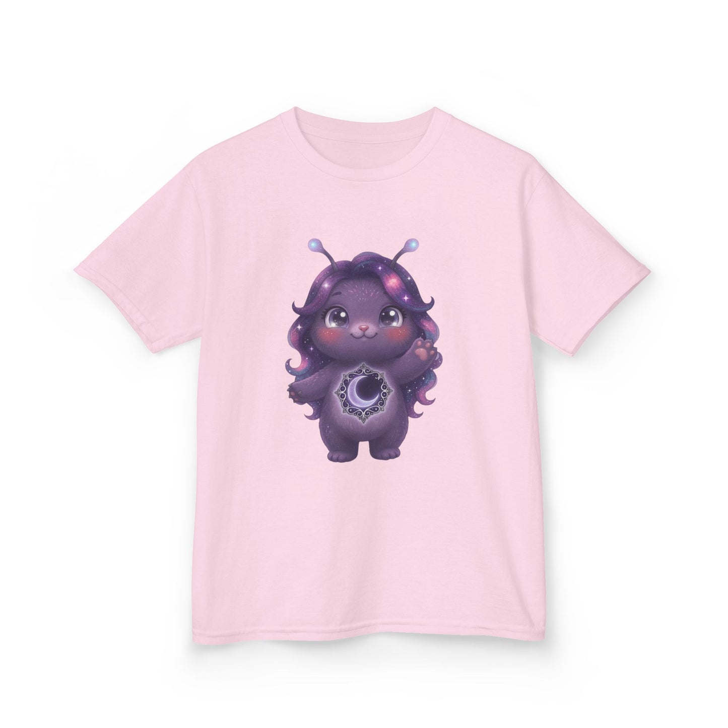 Light pink crew-neck t-shirt featuring a cute purple galaxy creature with antennae, long wavy hair, and a glowing crescent moon emblem on its chest.