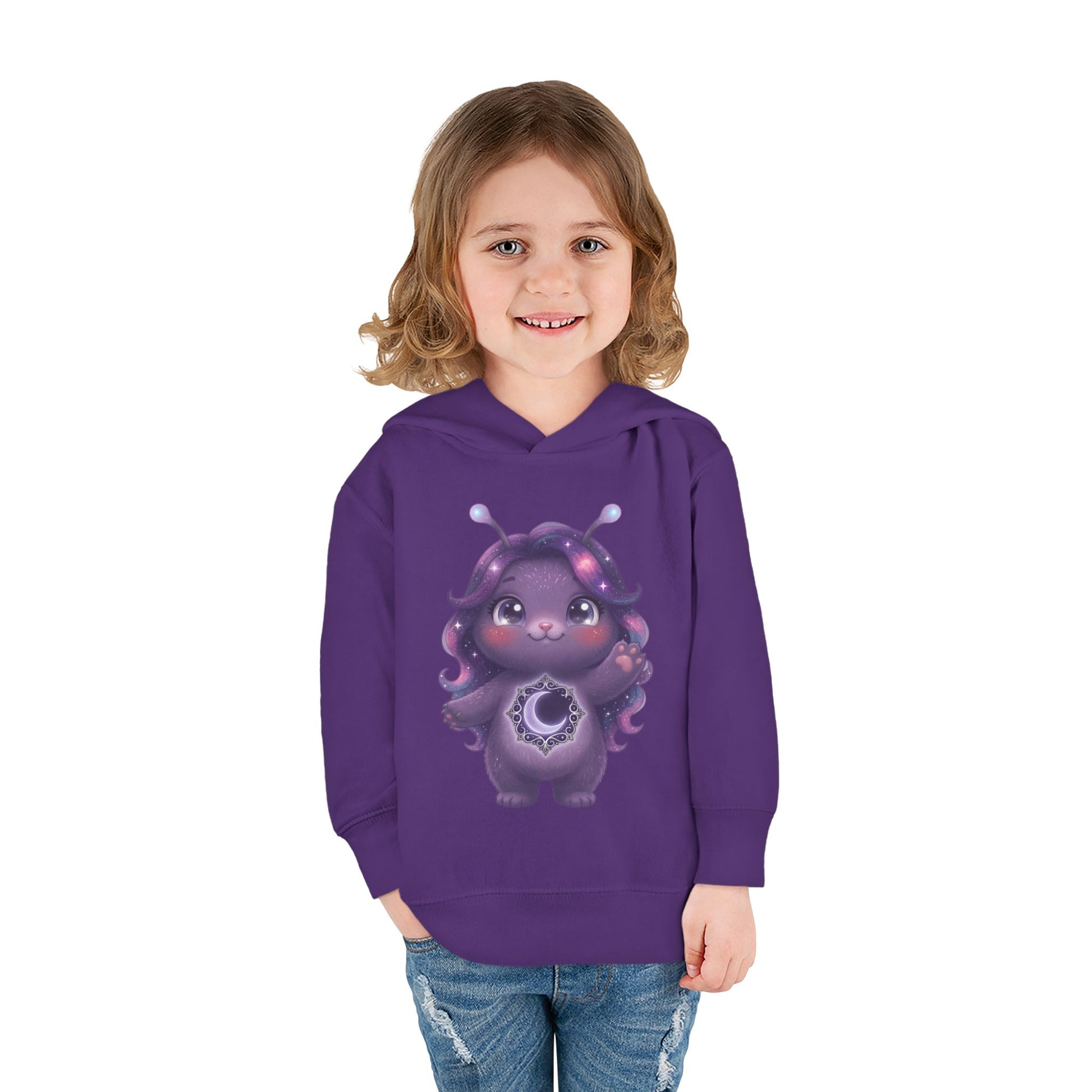 Purple hoodie featuring a cute purple galaxy creature with antennae, long wavy hair, and a glowing crescent moon emblem on its chest.